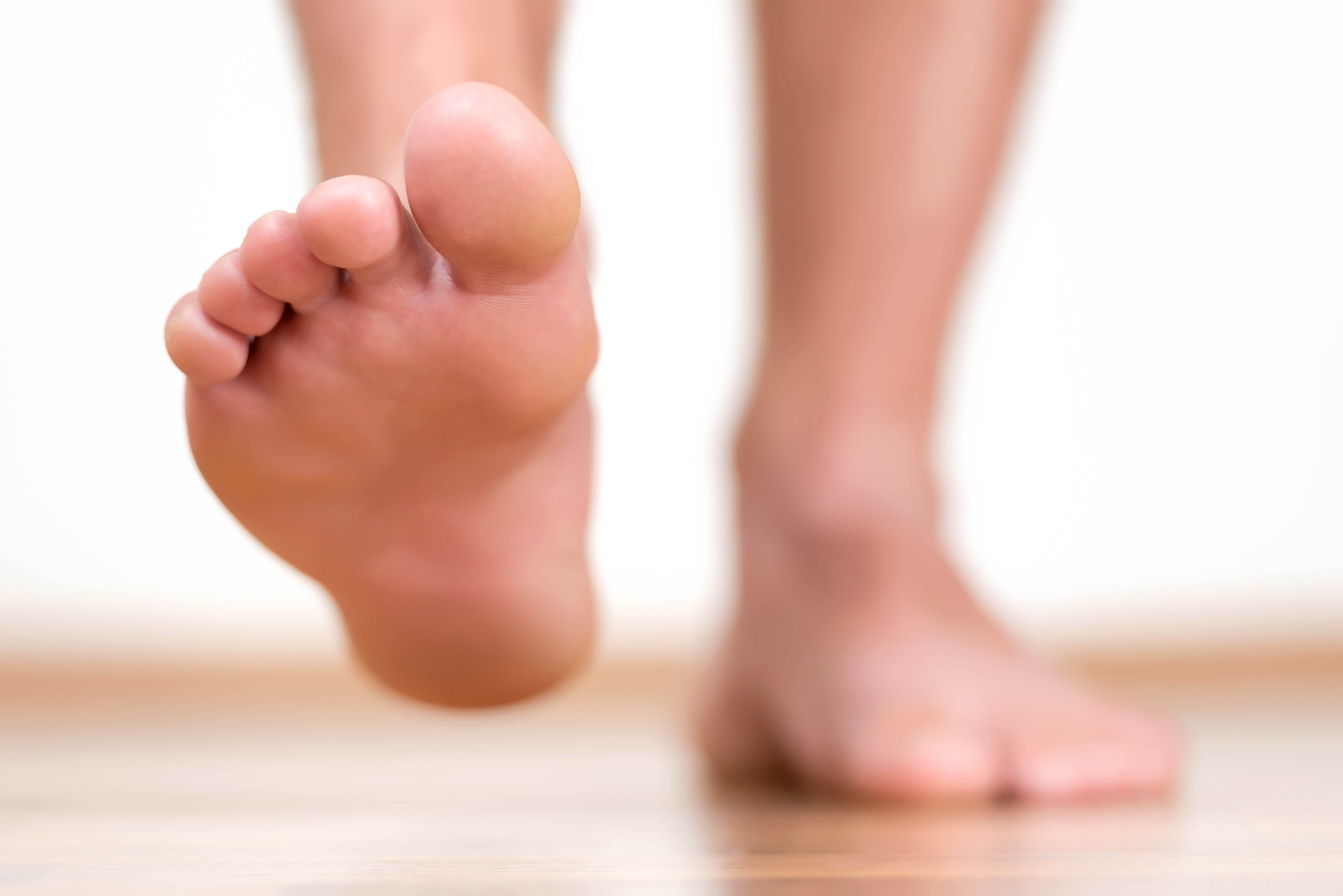 Close up of walking bare feet